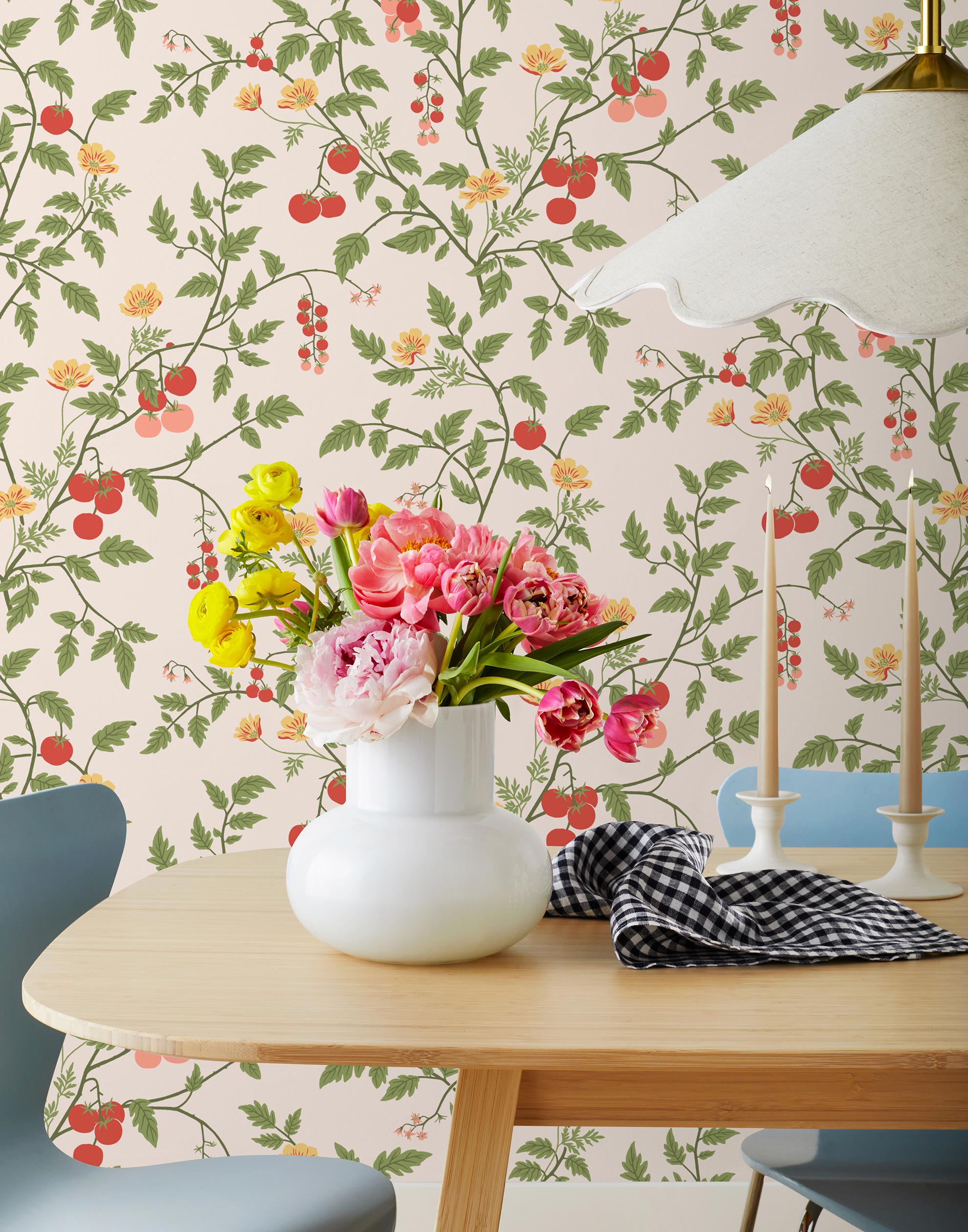 Our Heirloom wallpaper celebrates the annual arrival of tomato season. Highly durable, fade resistant, and made in the USA. This wallpaper features red and pink tomatoes, yellow flowers and green vines on a pink background and was created in collaboration with The Aesthetics of Joy.