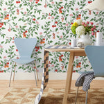 Our Heirloom wallpaper celebrates the annual arrival of tomato season. Highly durable, fade resistant, and made in the USA. This wallpaper features red and orange tomatoes, pink flowers and green vines on a white background and was created in collaboration with The Aesthetics of Joy.