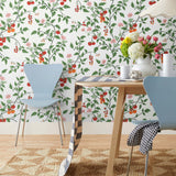 Our Heirloom wallpaper celebrates the annual arrival of tomato season. Highly durable, fade resistant, and made in the USA. This wallpaper features red and orange tomatoes, pink flowers and green vines on a white background and was created in collaboration with The Aesthetics of Joy.