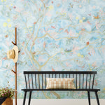 Watercolored birds, butterflies and tree sprites flutter about in an orchard of trees in our Tree Sprites mural. Yellow, pink, peach, and green on a soft blue background. Hillery Sproat + Hygge & West