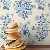This large-scale wallpaper features hand drawn bees, butterflies and other garden friends frolic among flowers - camellias, hellebores, irises, and snowball trees. Harmony (Porcelain) is printed in shades of blue on a cream background.