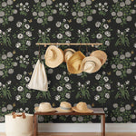 This large-scale wallpaper features hand drawn bees, butterflies and other garden friends frolic among flowers - camellias, hellebores, irises, and snowball trees. Harmony (Ebony) is printed in shades of green and white on a black background.