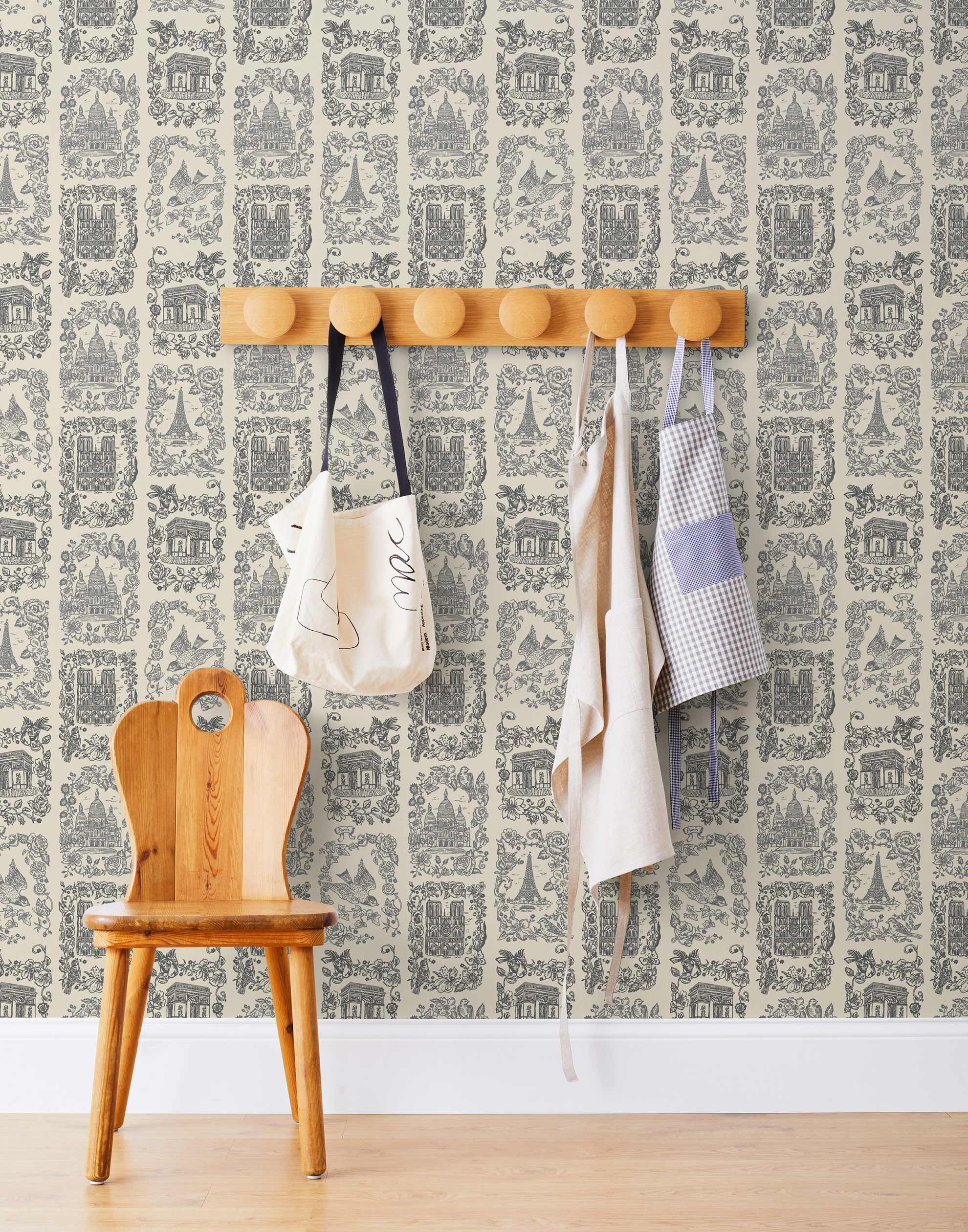 Je T'aime Paris (Parchment) wallpaper featuring gray illustrations of Paris landmarks on a cream background | Nathalie Lete + Hygge & West