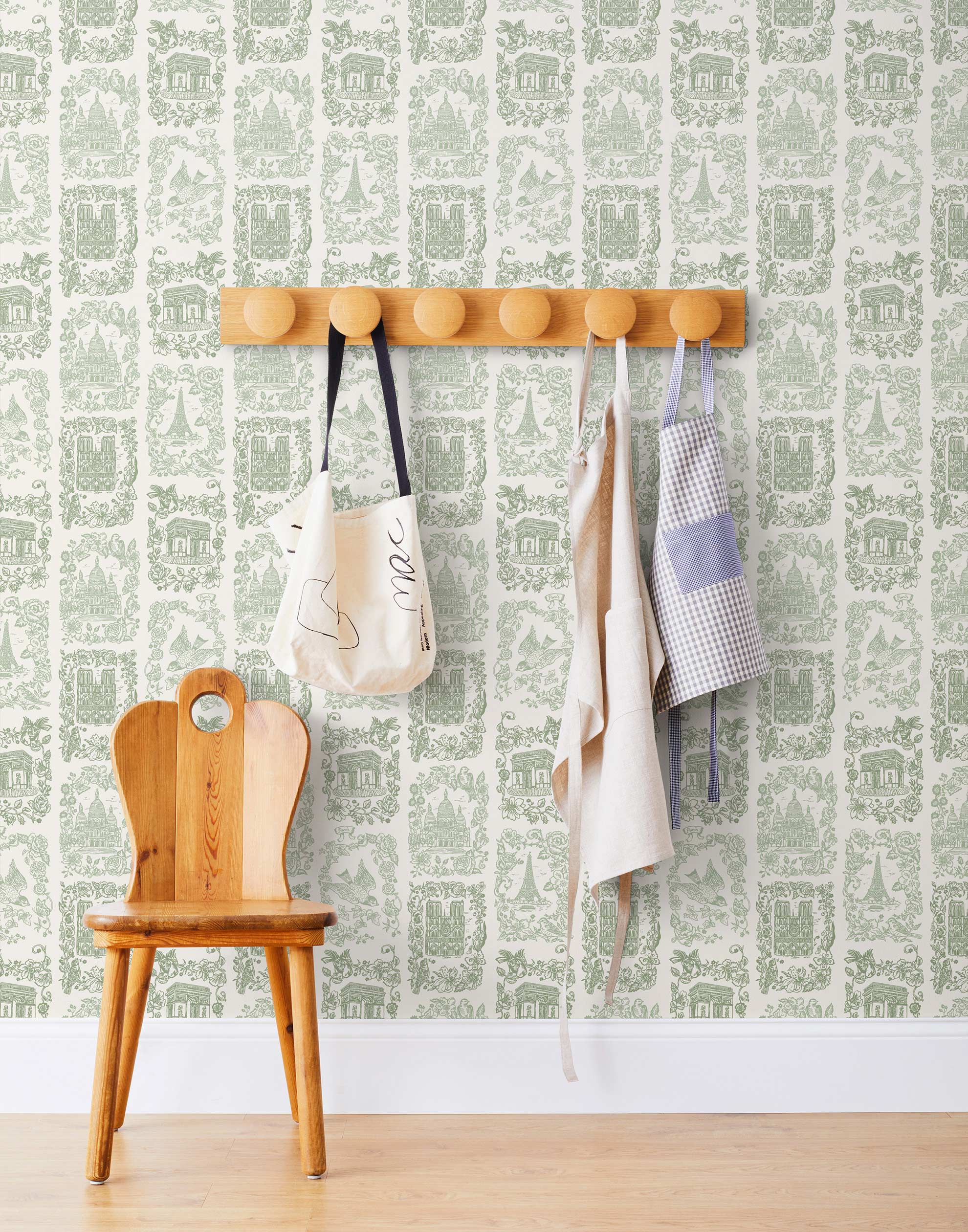 Je T'aime Paris (Sage) wallpaper featuring green illustrations of Paris landmarks on a white background | Nathalie Lete + Hygge & West