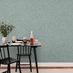 Alpine Garden Tonal (Mist) featuring hand drawn flowers in green on a dusty blue background | Schoolhouse x Hygge & West Wallpaper Collection