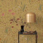 Alpine Garden Multi (Ochre) featuring hand drawn flowers in mustard, white, and pink with rust accents on a ochre background | Schoolhouse x Hygge & West Wallpaper Collection