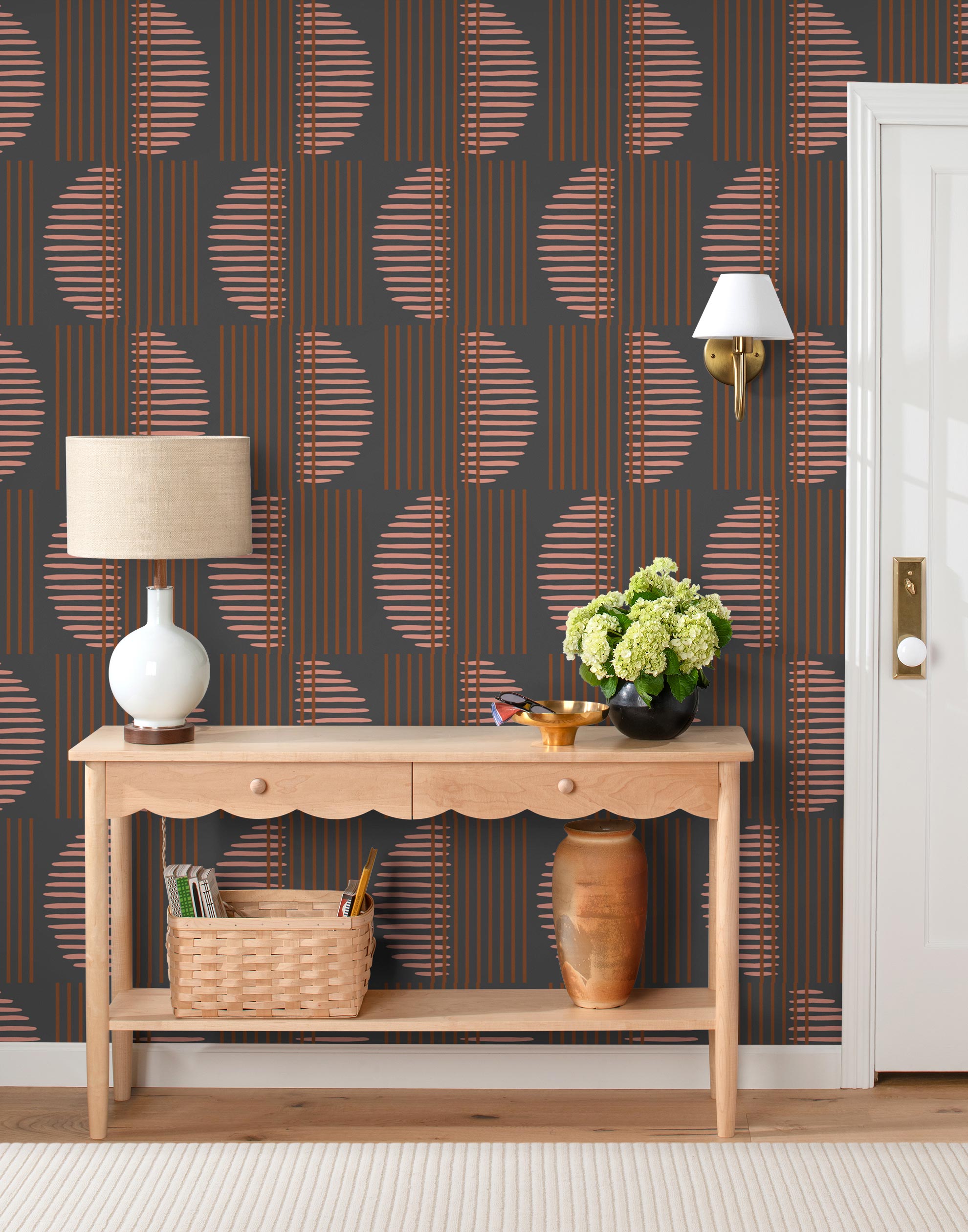 Wallpaper with irregular line work that weaves copper rectangles and pink semicircles on a deep gray background | Schoolhouse + Hygge & West