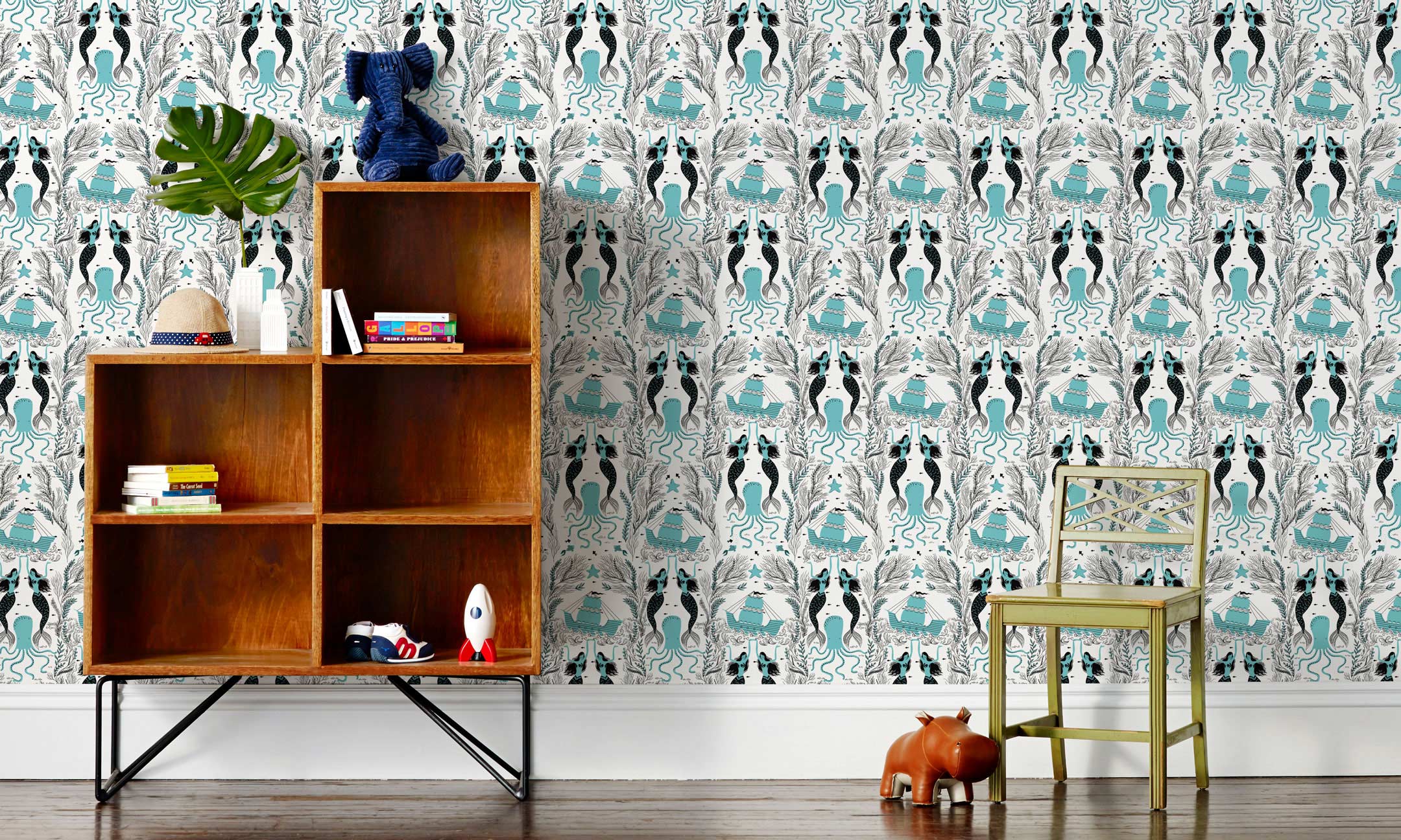 Mermaids (Ocean) wallpaper | Mermaids, fish, octopi and ships float in this charming design | turquoise and black artwork on an off white ground