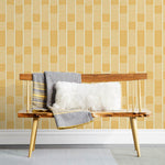 Wallpaper with undulating yellow lines that form rhythmic columns on a white background | Schoolhouse + Hygge & West