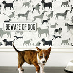 Dog Park (Gray) wallpaper featuring illustrated dogs in shades of gray on white designed by Julia Rothman