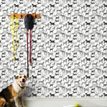 Dog Park (Gray) wallpaper featuring illustrated dogs in shades of gray on white designed by Julia Rothman