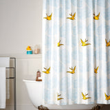Daydream (Sunshine) Shower Curtain features a pattern of flying birds and floating clouds in yellow and blue on white