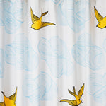 Daydream (Sunshine) Shower Curtain features a pattern of flying birds and floating clouds in yellow and blue on white