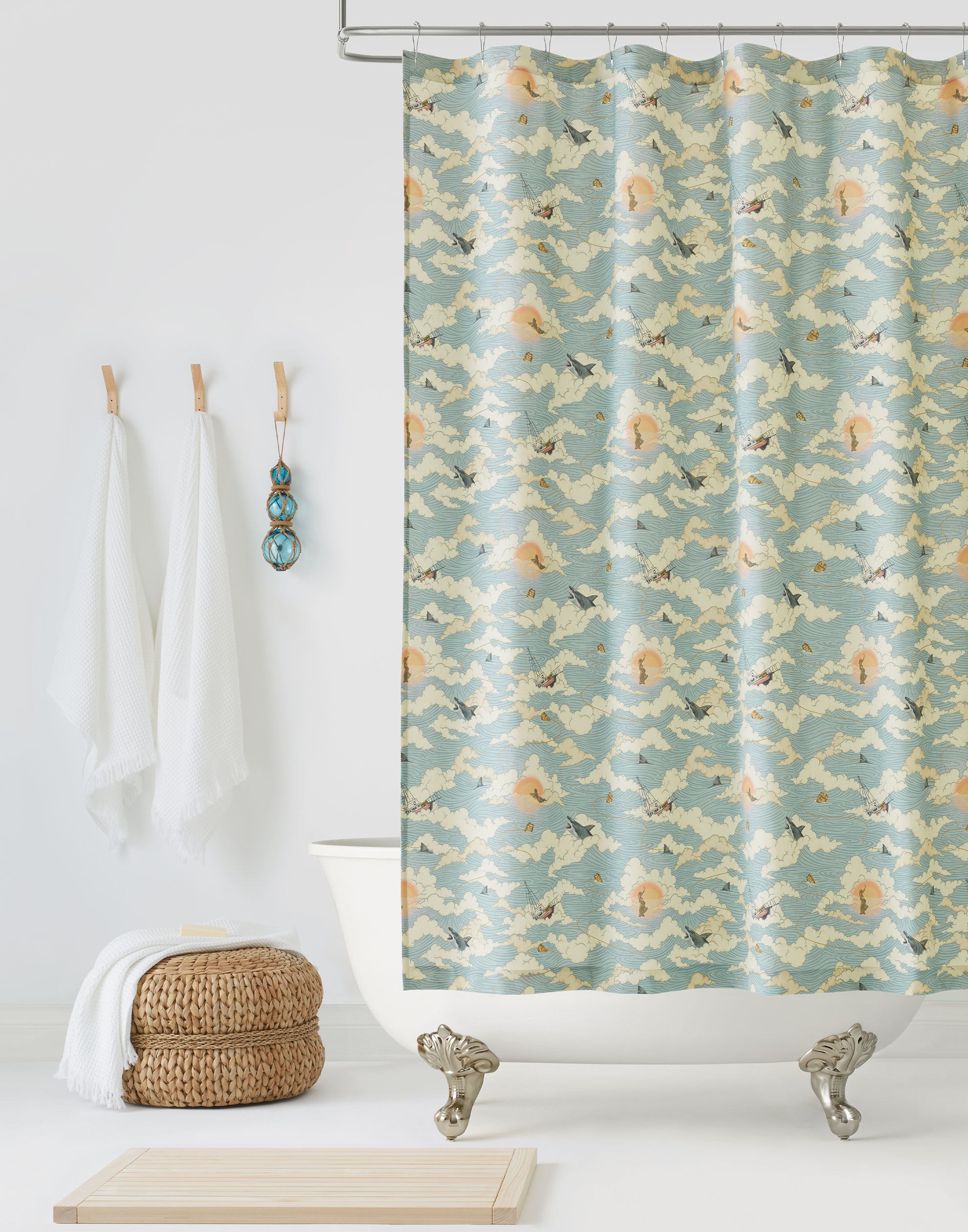 Amity Sunset (Sky) Shower Curtain with dusty blue, orange, and cream illustrations depicts scenes from the iconic movie Jaws and was created in collaboration with Universal | Hygge & West